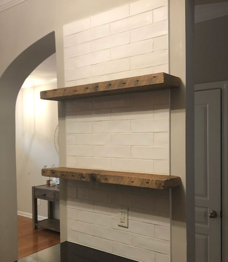 Tile accent wall with floating shelves Wake Forest