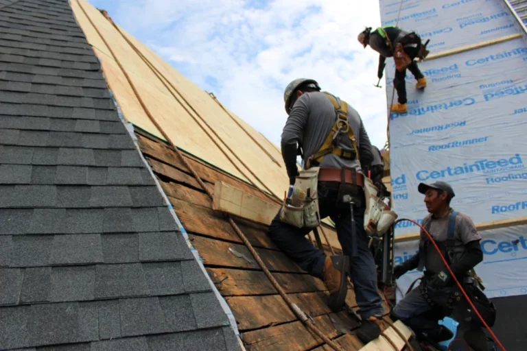 Roofing crew installs roof sheathing on church roof 1024x682 1 768x512